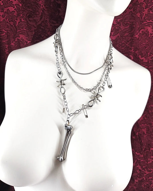 Collier en acier inoxydable avec os forgé chaines et épingles à nourrice et barbelés